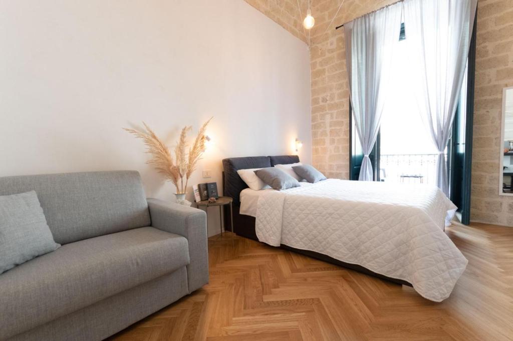 Postel nebo postele na pokoji v ubytování Centro Storico Rooms & Suites