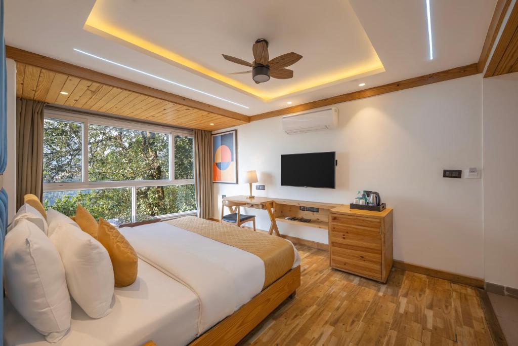 Televiisor ja/või meelelahutuskeskus majutusasutuses Echor Baris Resort Mussoorie