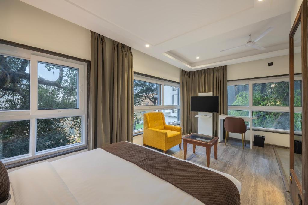 Voodi või voodid majutusasutuse Echor Baris Resort Mussoorie toas
