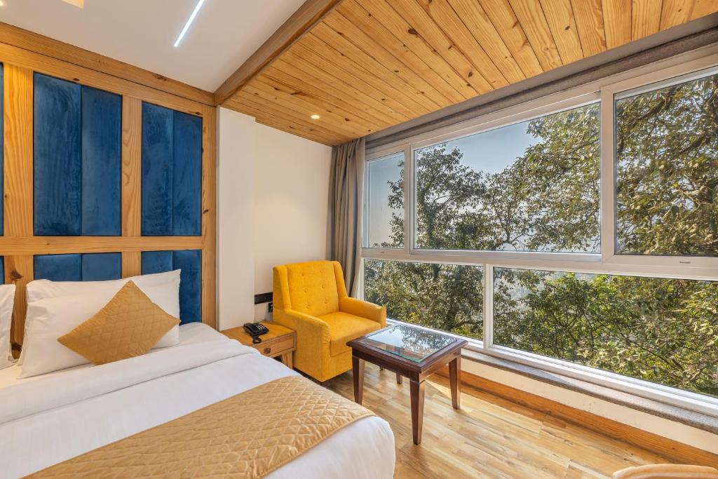 Voodi või voodid majutusasutuse Echor Baris Resort Mussoorie toas