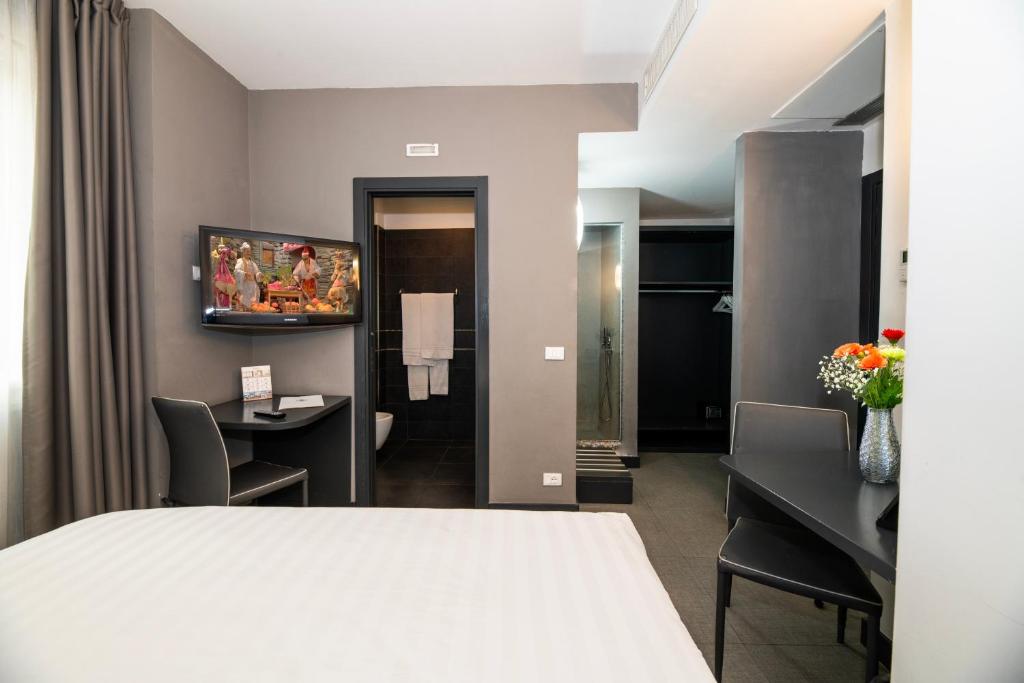 Postel nebo postele na pokoji v ubytování Golden Hotel