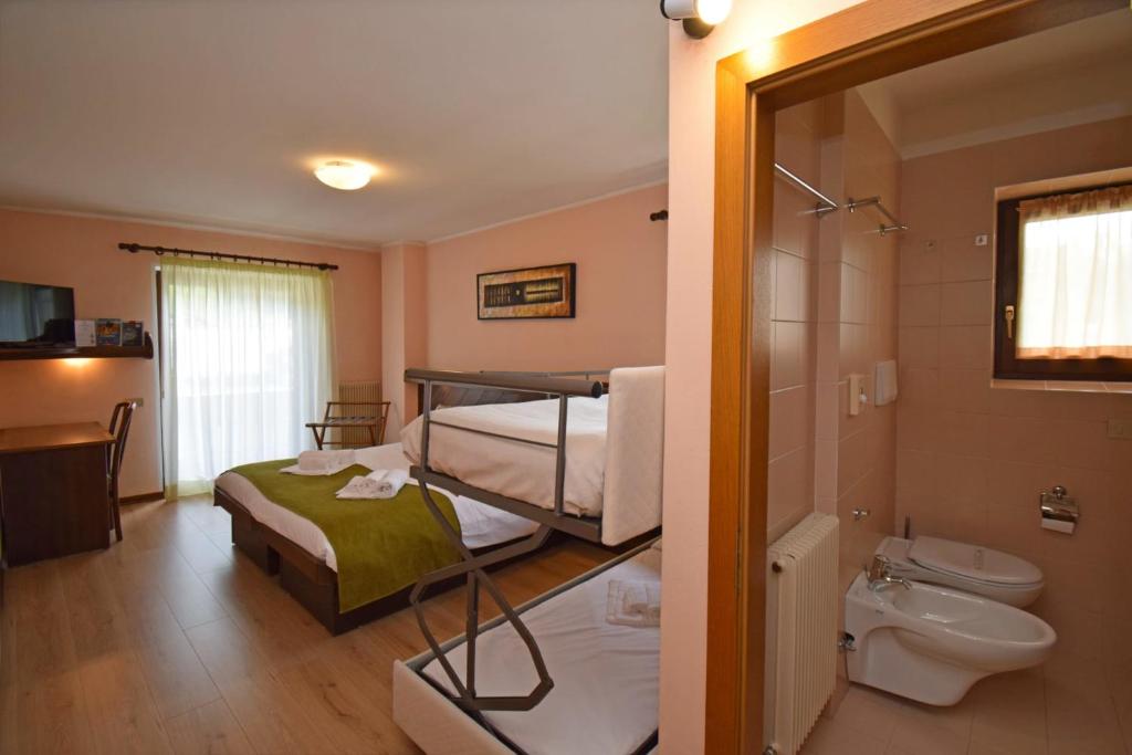 Postel nebo postele na pokoji v ubytování Hotel Comelico