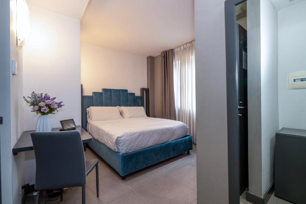 Postel nebo postele na pokoji v ubytování Golden Hotel
