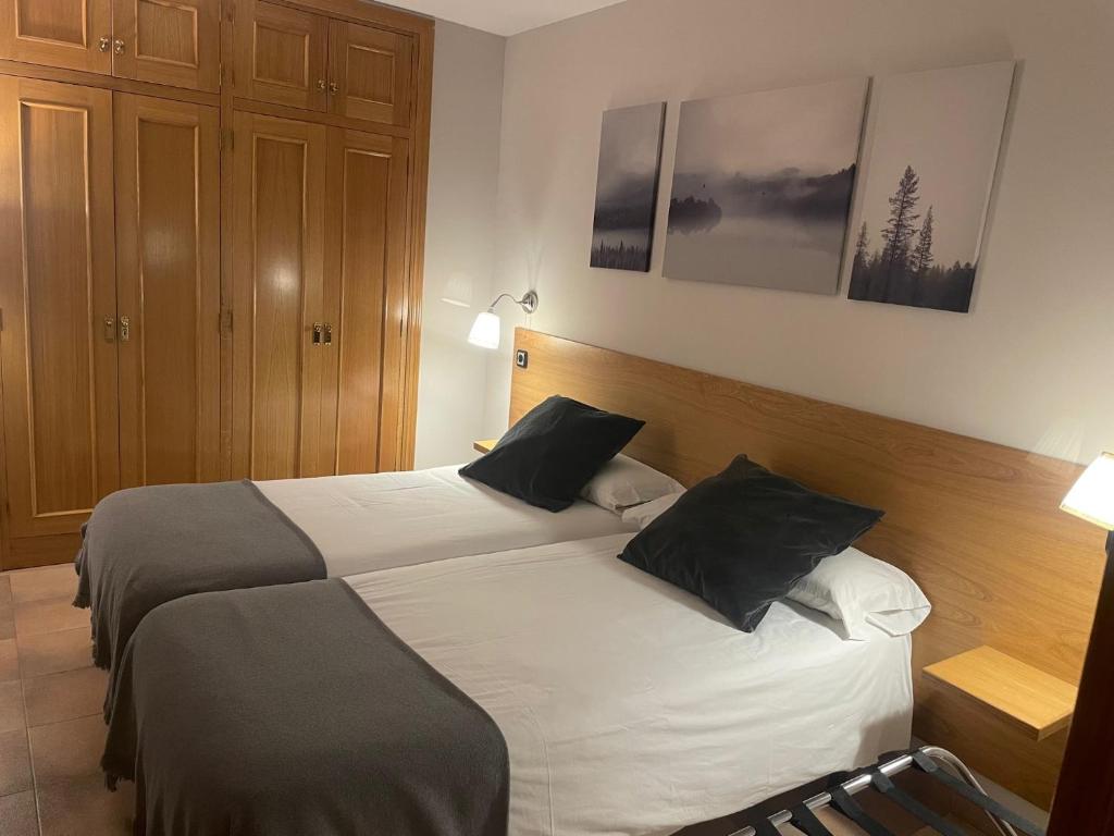 Postel nebo postele na pokoji v ubytování Aparthotel El Serch