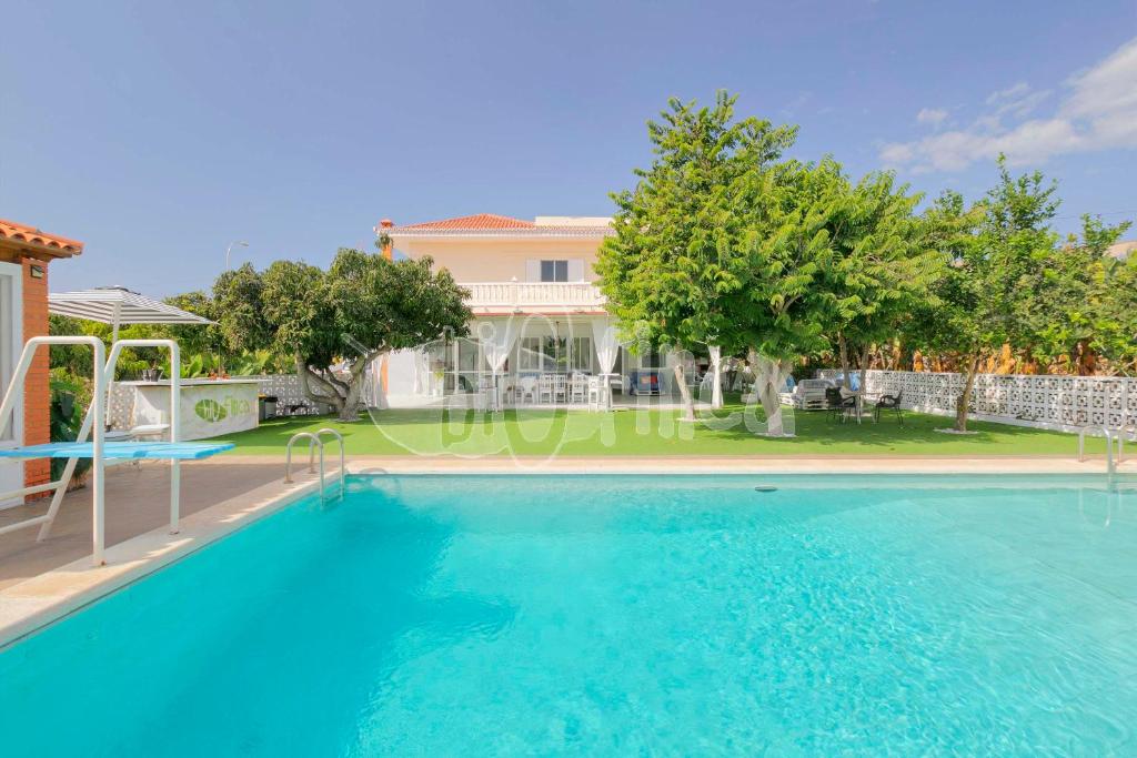 a villa with a swimming pool and a house at Villa Bio Finca With Pool in Playa Paraiso