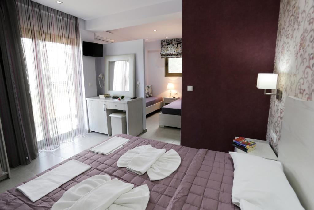 Postel nebo postele na pokoji v ubytování Hotel Akti