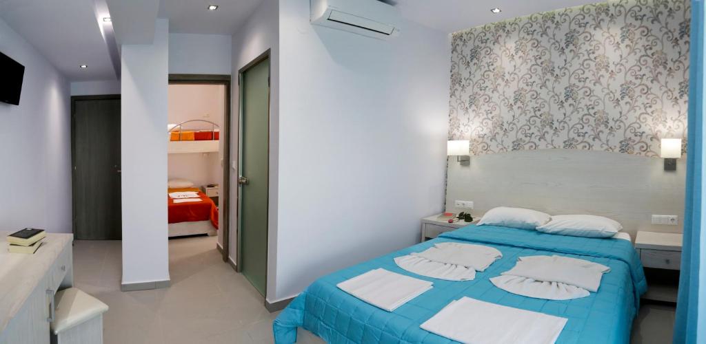 Postel nebo postele na pokoji v ubytování Hotel Akti