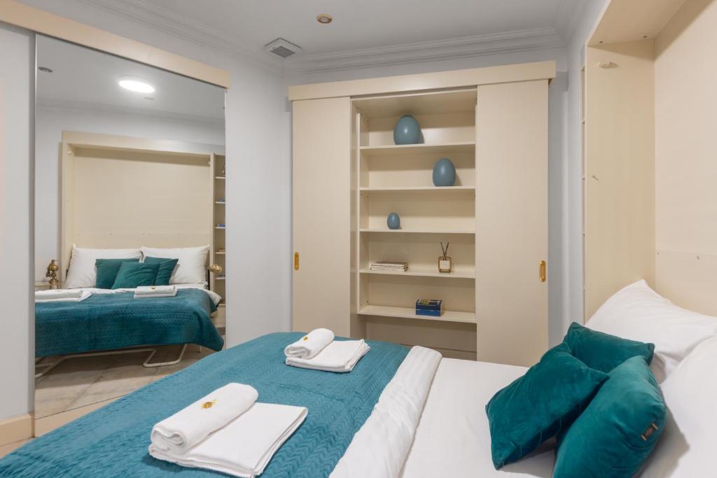 Postel nebo postele na pokoji v ubytování President Boutique Apartments #8 by Goodnite cz