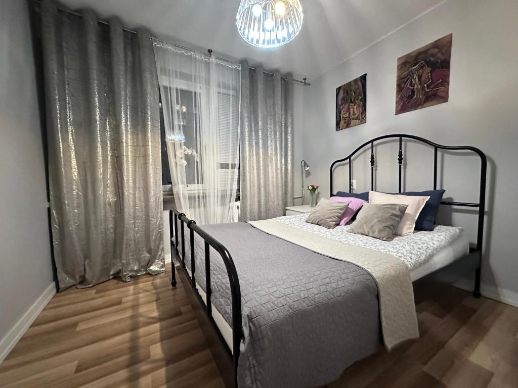 Posteľ alebo postele v izbe v ubytovaní CityApartHome6 CENTRUM PARKING