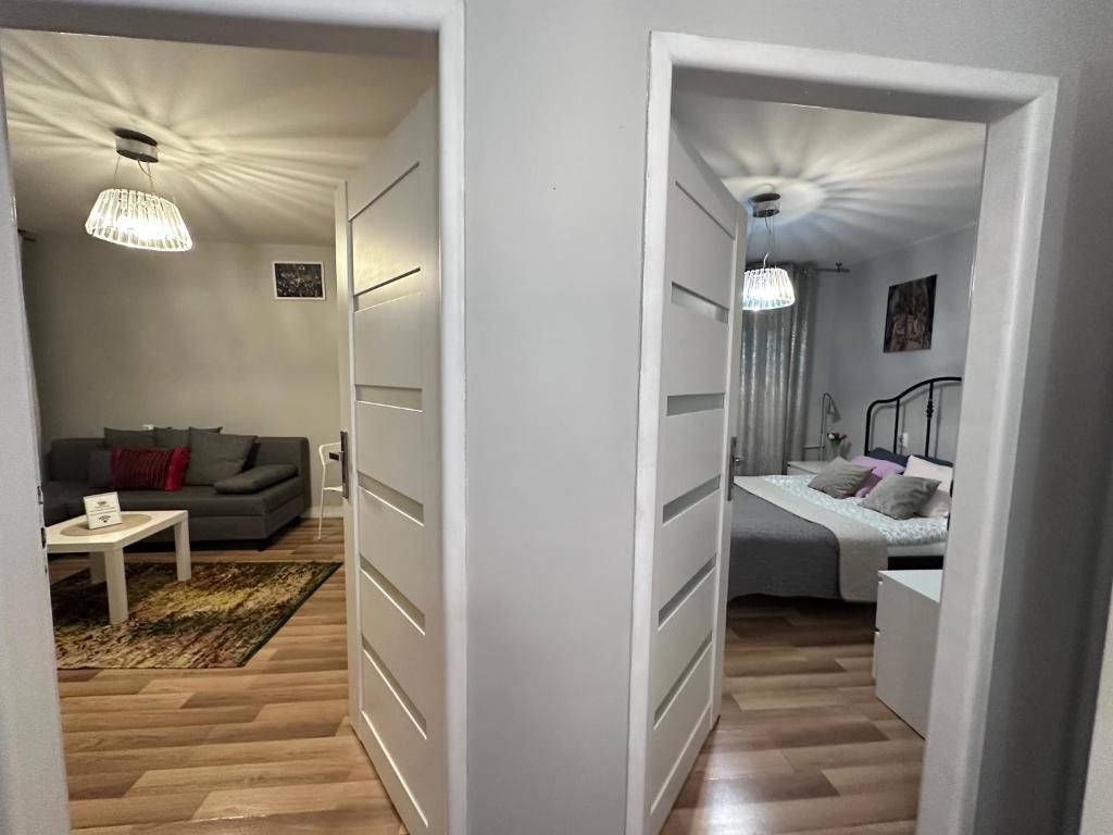 Posteľ alebo postele v izbe v ubytovaní CityApartHome6 CENTRUM PARKING