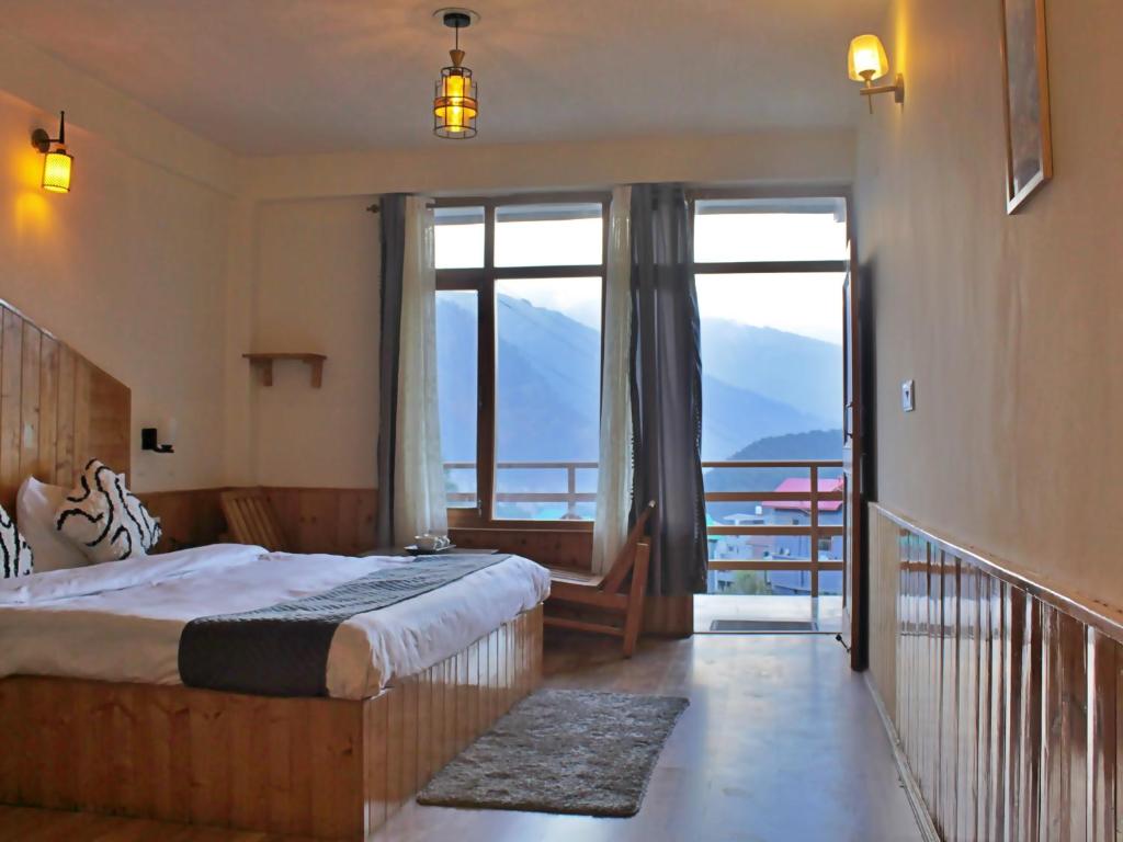 Postel nebo postele na pokoji v ubytování Bayith Cafe and Stay