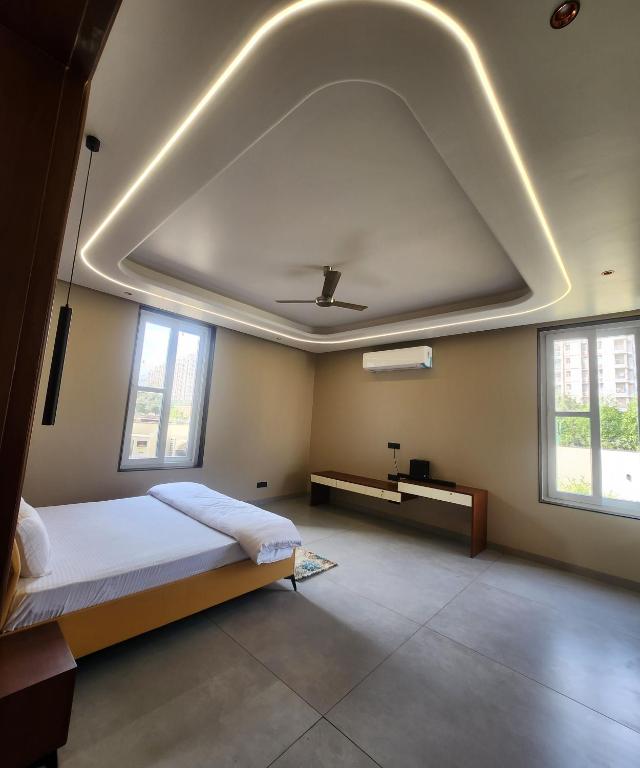 Postel nebo postele na pokoji v ubytování JK House