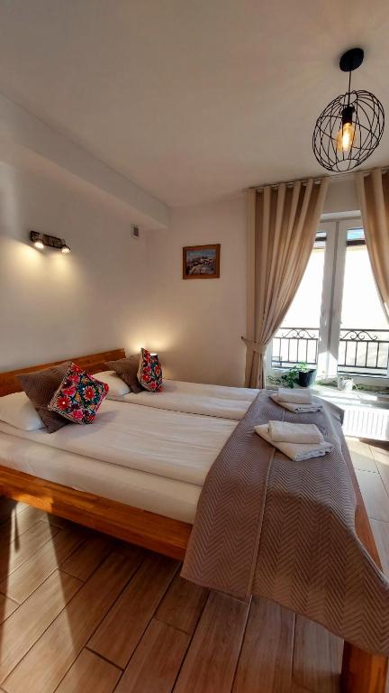 Posteľ alebo postele v izbe v ubytovaní Apartamenty Biała Perła