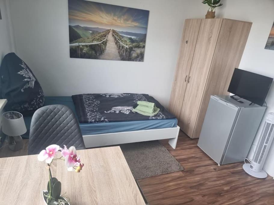 TV a/nebo společenská místnost v ubytování Monteurwohnung in Marl - Kamp 13 - 1OGM