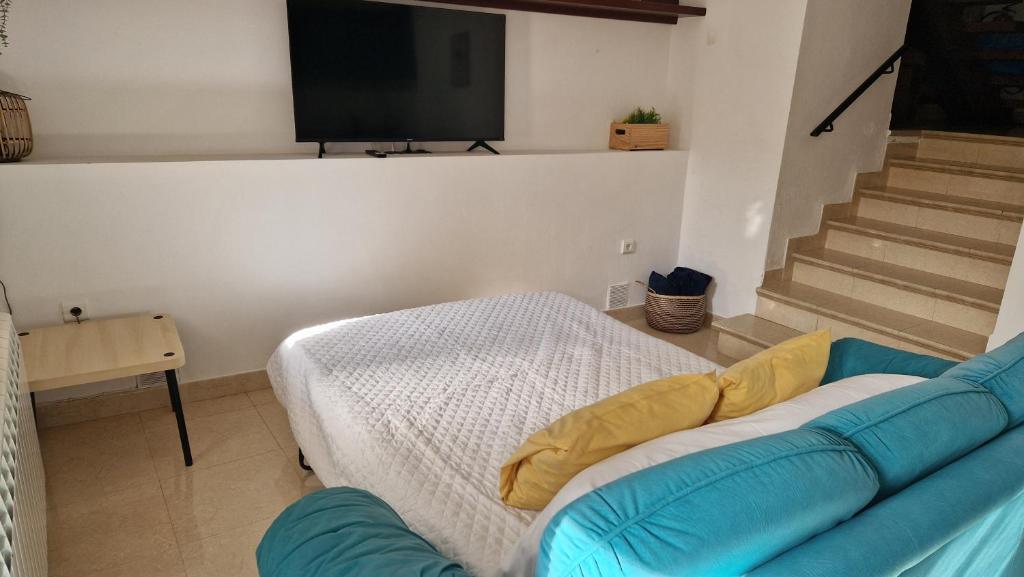 A bed or beds in a room at El Callejón
