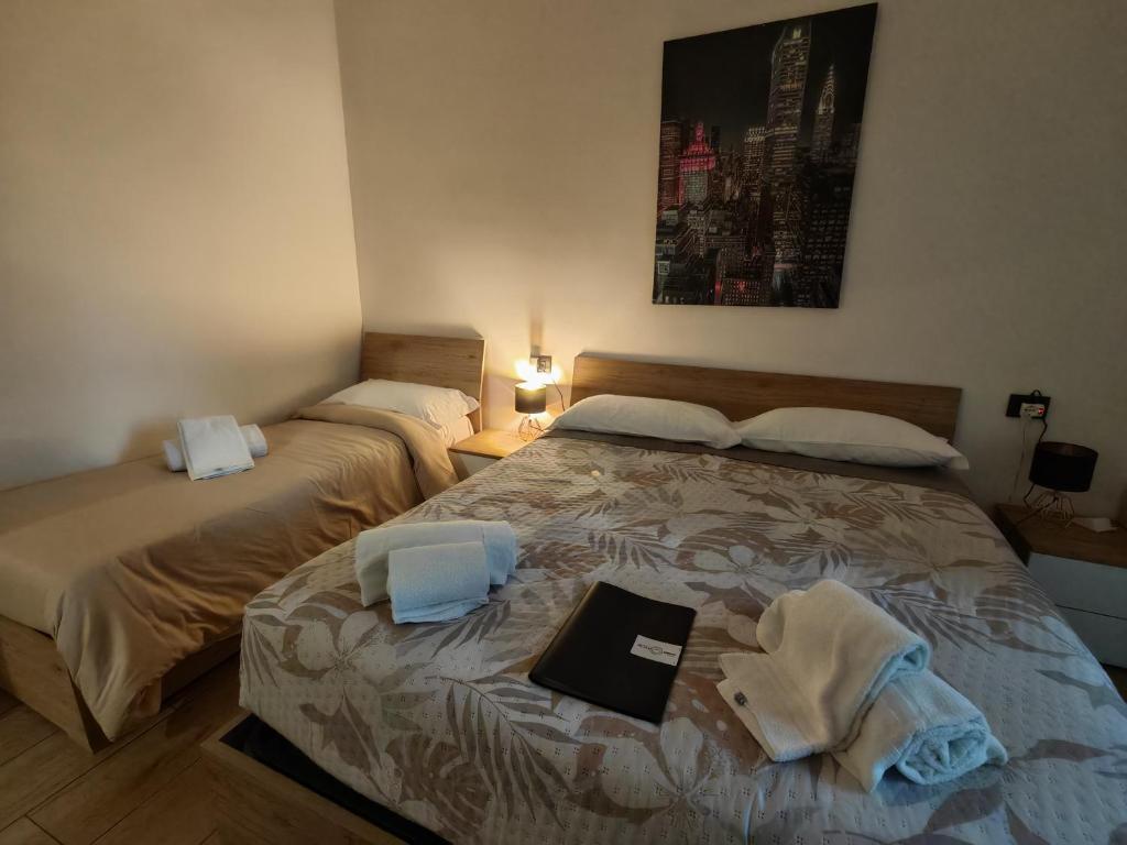 Postel nebo postele na pokoji v ubytování MC FLY ROOMS Malpensa airport