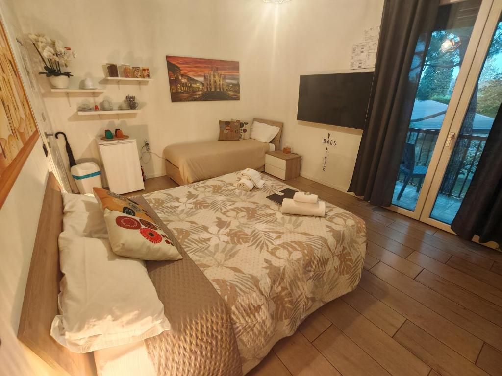 Postel nebo postele na pokoji v ubytování MC FLY ROOMS Malpensa airport