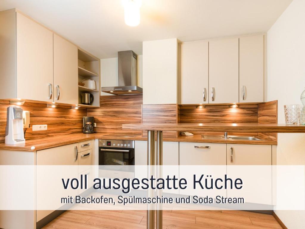 Kuchyňa alebo kuchynka v ubytovaní Apartments Tannheim - bei Birgit Mariacher - inklusive Sommerbergbahnen - Infrarotsauna & Brötchenservice - zentral mit Bergblick
