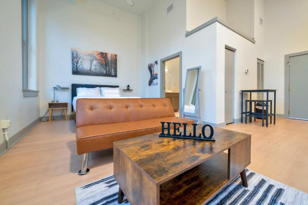 a living room with a couch and a coffee table at Bright and Modern Studio in Louisville # 302 in Louisville