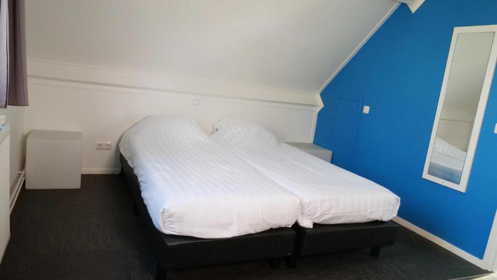 Postel nebo postele na pokoji v ubytování Walibi Village