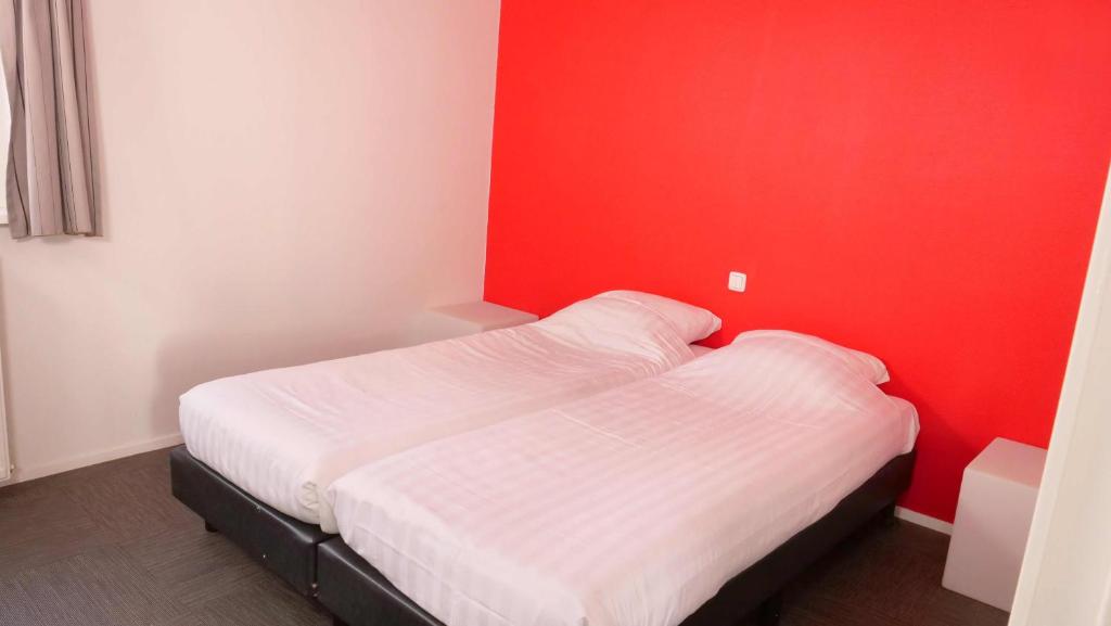 Postel nebo postele na pokoji v ubytování Walibi Village