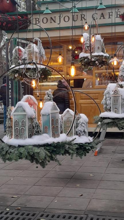 a display of snow covered buildings in a store at Cathedral Park Smart Apartment in Chişinău
