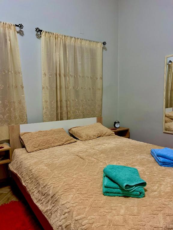 Postel nebo postele na pokoji v ubytování Niki Cottage