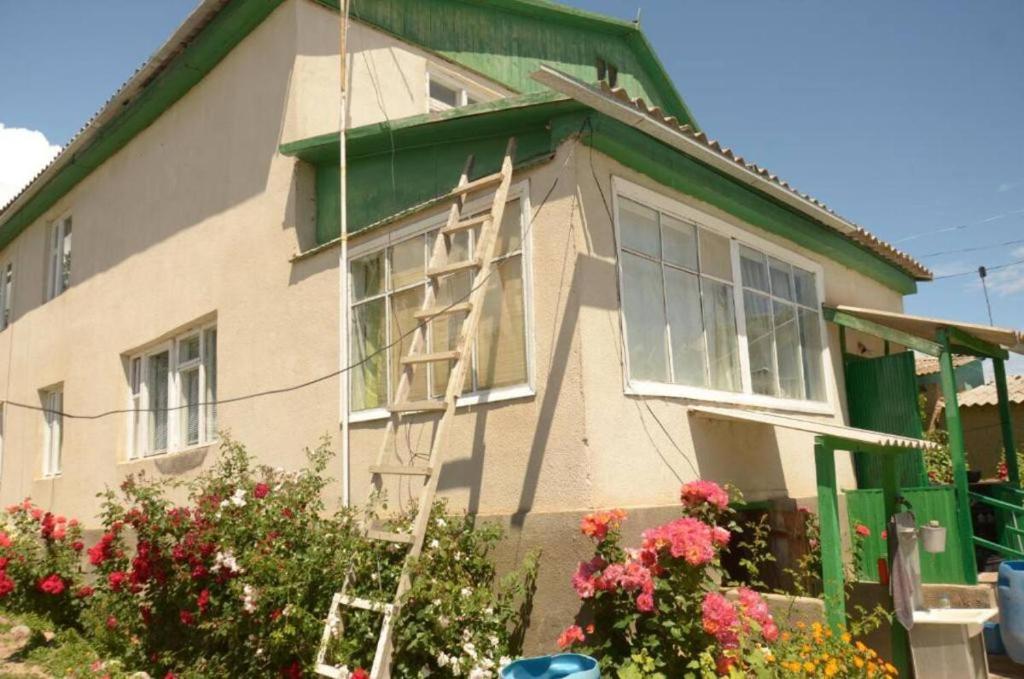 a house being constructed with scaffolding on it at Гостевой дом Sabyl in Cholpon-Ata