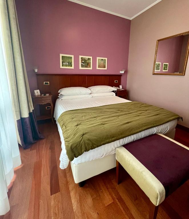 Postel nebo postele na pokoji v ubytování Hotel Fenix