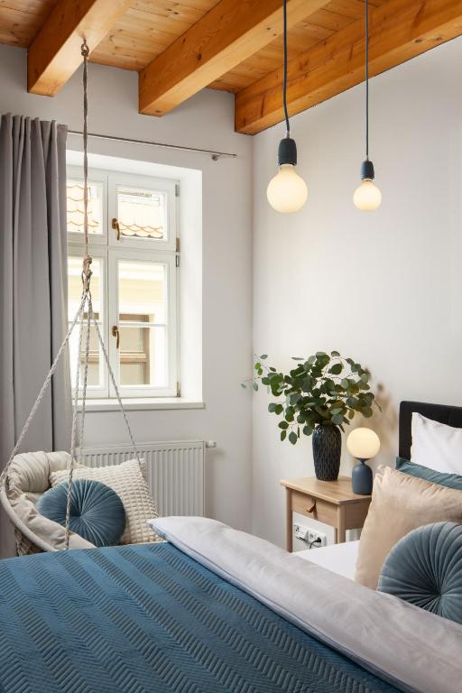 Postel nebo postele na pokoji v ubytování Zelný Trh Boutique Apartments #11 by Goodnite cz