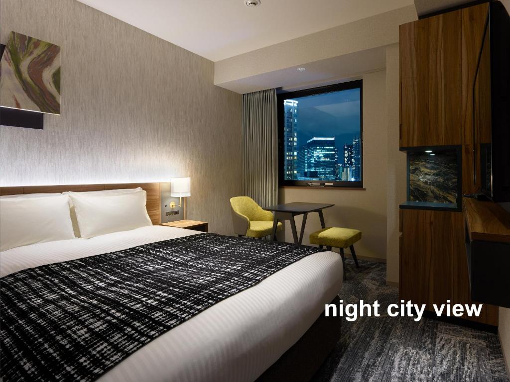 Postel nebo postele na pokoji v ubytování Mitsui Garden Hotel Gotanda - Tokyo
