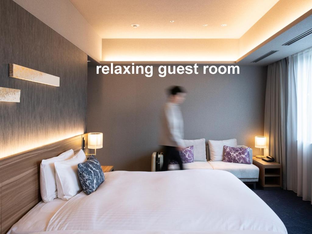 Postel nebo postele na pokoji v ubytování Mitsui Garden Hotel Gotanda - Tokyo