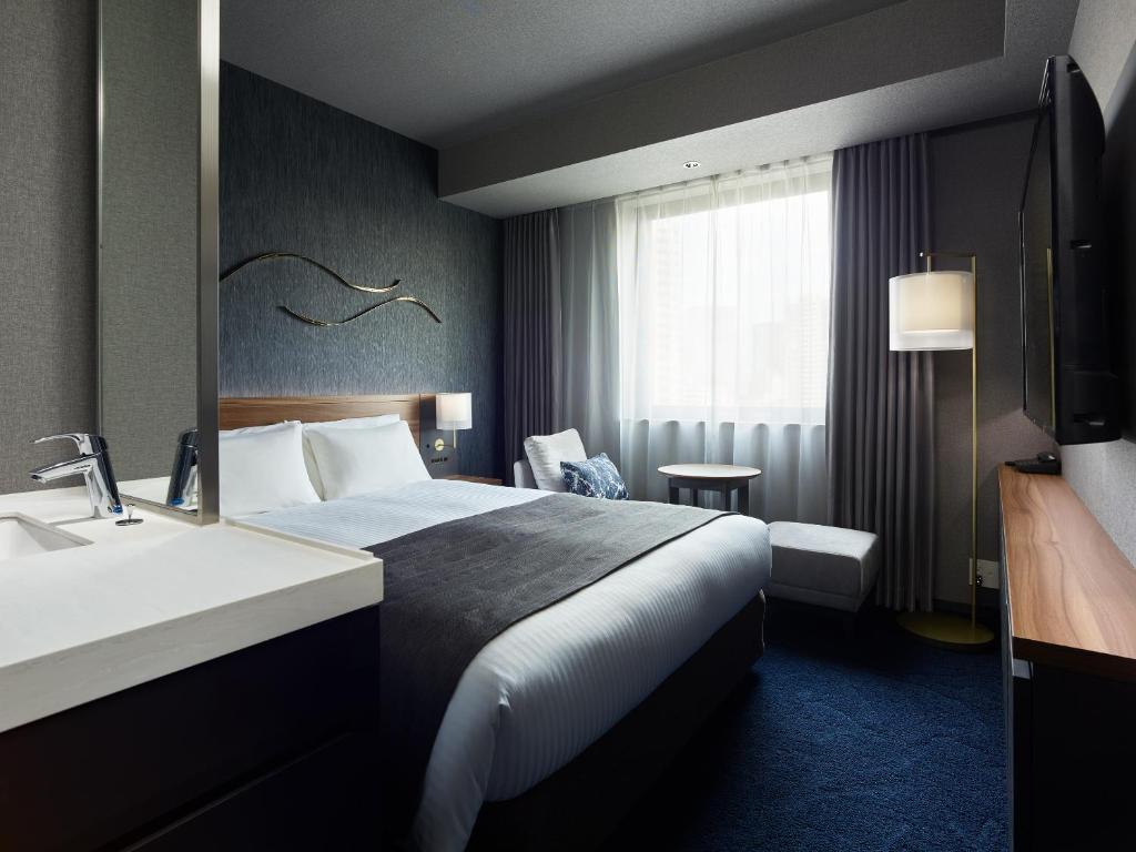 Postel nebo postele na pokoji v ubytování Mitsui Garden Hotel Gotanda - Tokyo