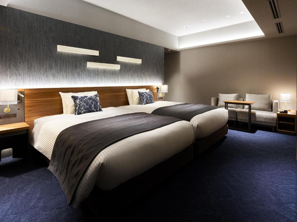 Postel nebo postele na pokoji v ubytování Mitsui Garden Hotel Gotanda - Tokyo