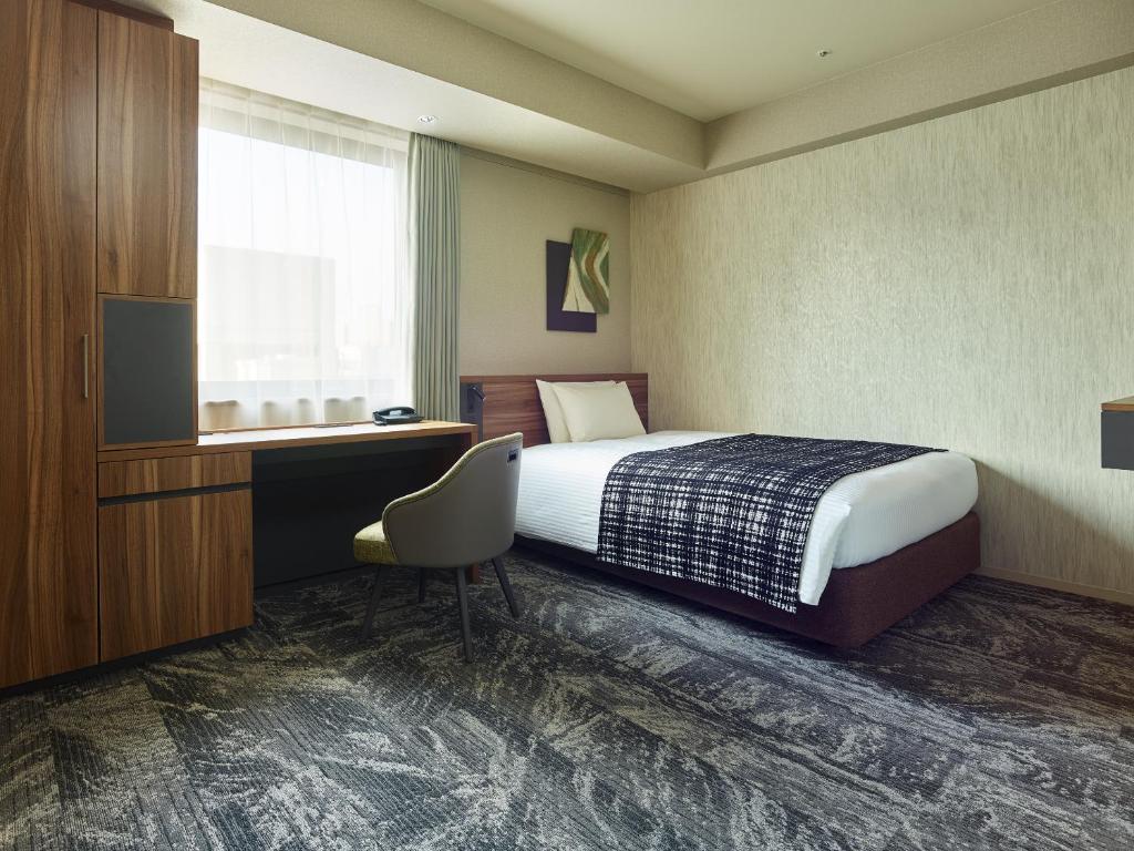 Postel nebo postele na pokoji v ubytování Mitsui Garden Hotel Gotanda - Tokyo