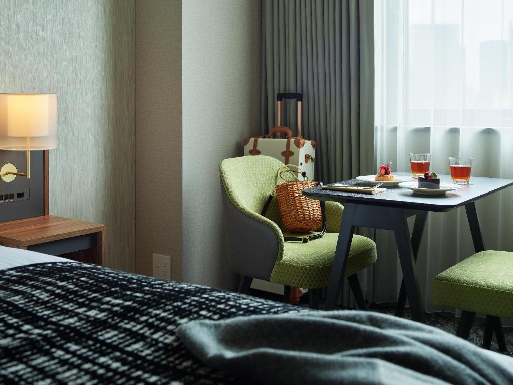 Postel nebo postele na pokoji v ubytování Mitsui Garden Hotel Gotanda - Tokyo