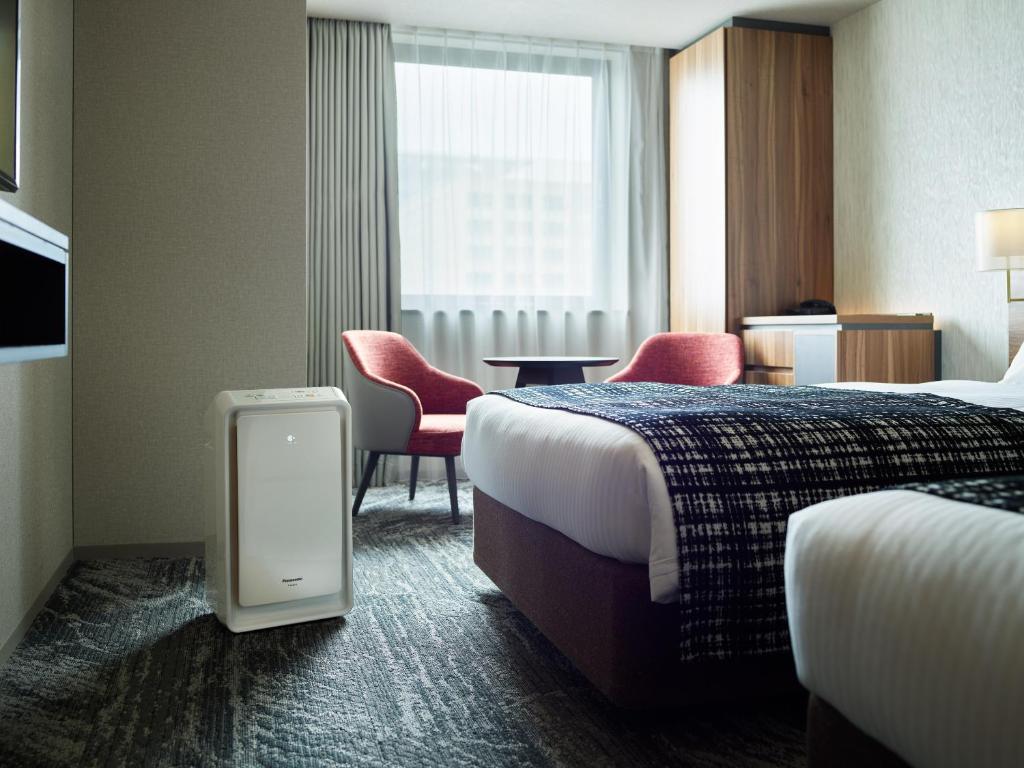 Postel nebo postele na pokoji v ubytování Mitsui Garden Hotel Gotanda - Tokyo