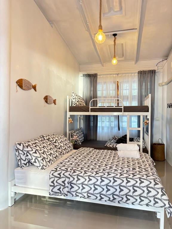 a bedroom with a bunk bed in a room at P Vacation Libong in Ko Libong