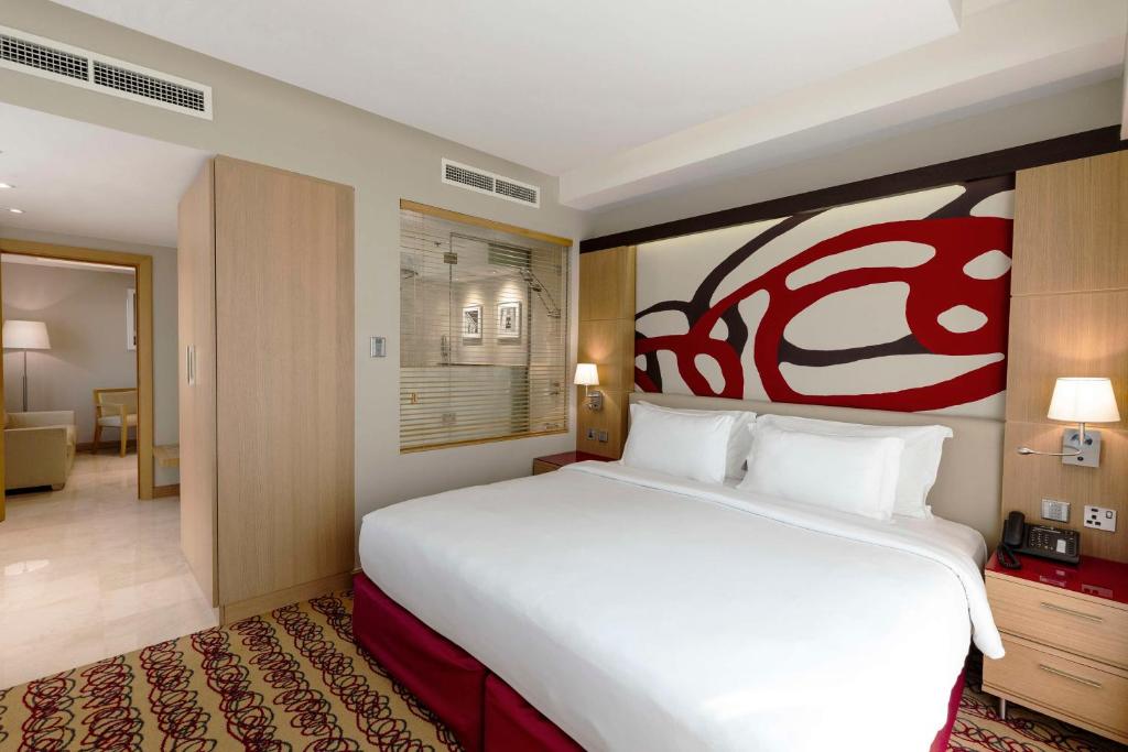 Letto o letti in una camera di Radisson Blu Hotel, Doha