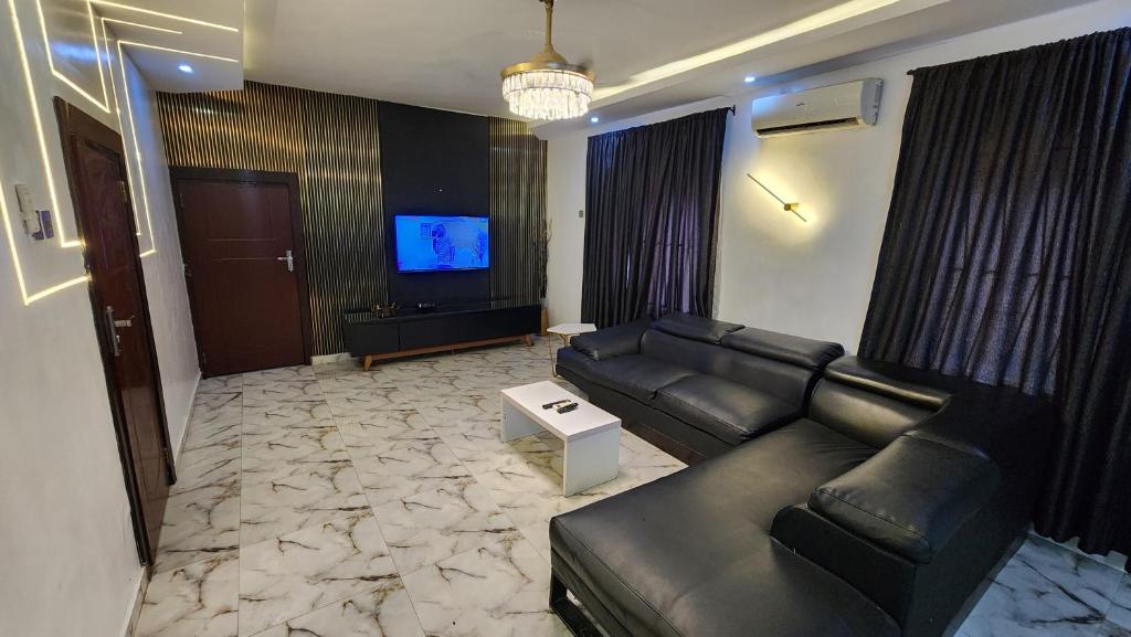 TV a/nebo společenská místnost v ubytování CG Apartments