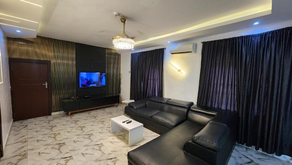 TV a/nebo společenská místnost v ubytování CG Apartments