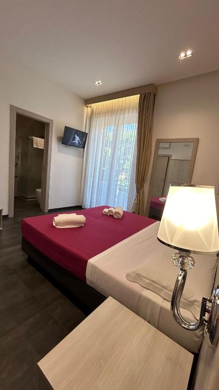 Postel nebo postele na pokoji v ubytování B&B Margherita