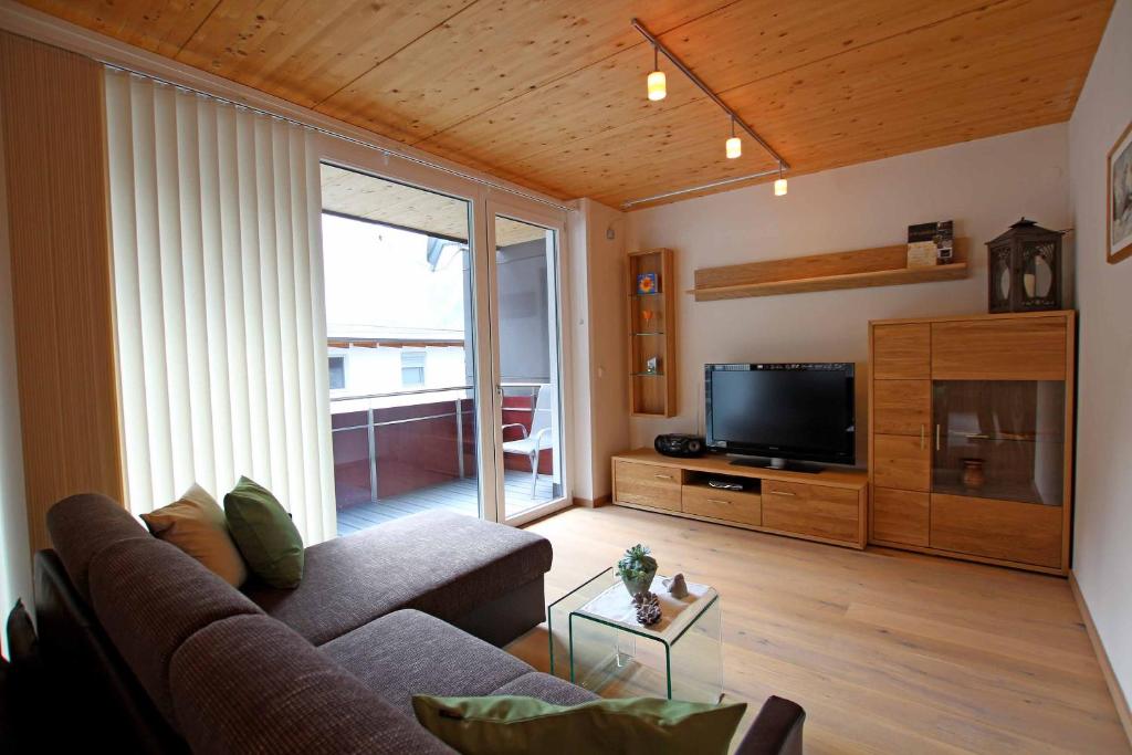 Televízia a/alebo spoločenská miestnosť v ubytovaní Apart Belmont