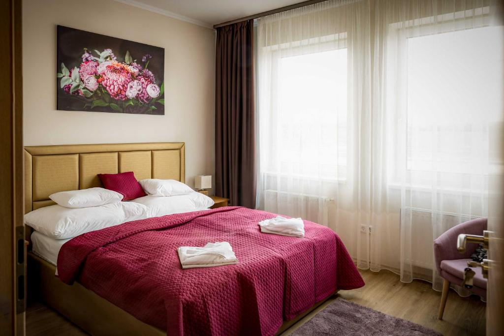 Posteľ alebo postele v izbe v ubytovaní Land-Plan Hotel