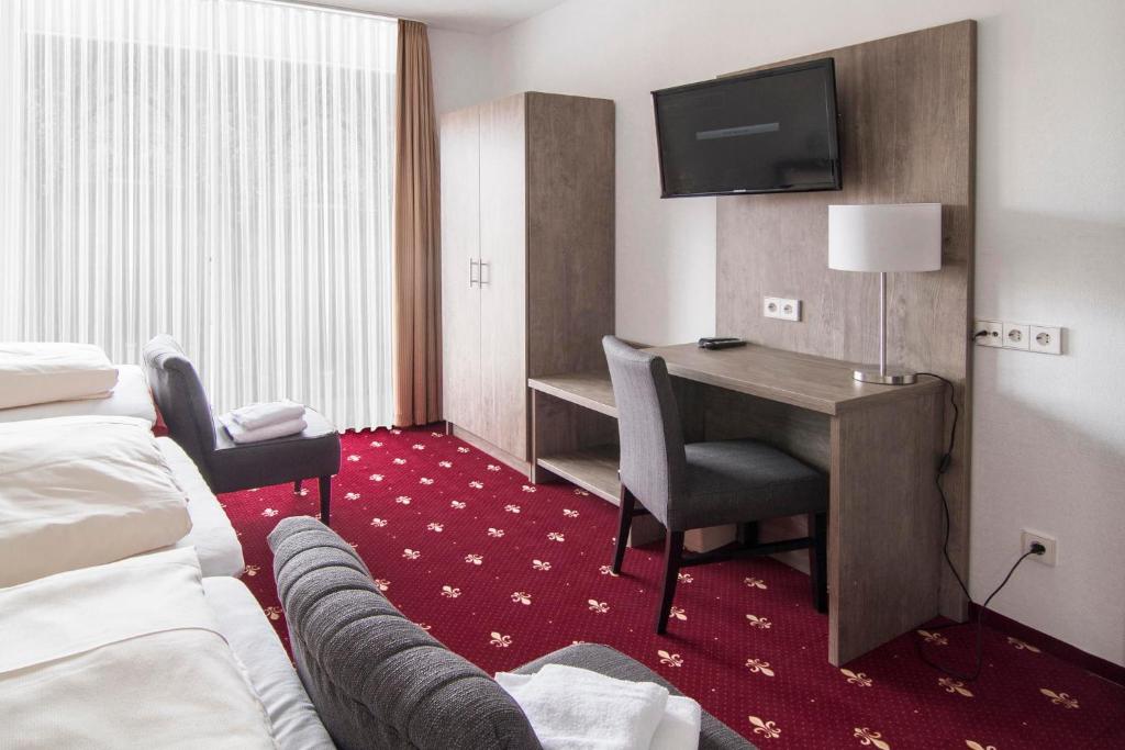 Postel nebo postele na pokoji v ubytování Hotel Maurer