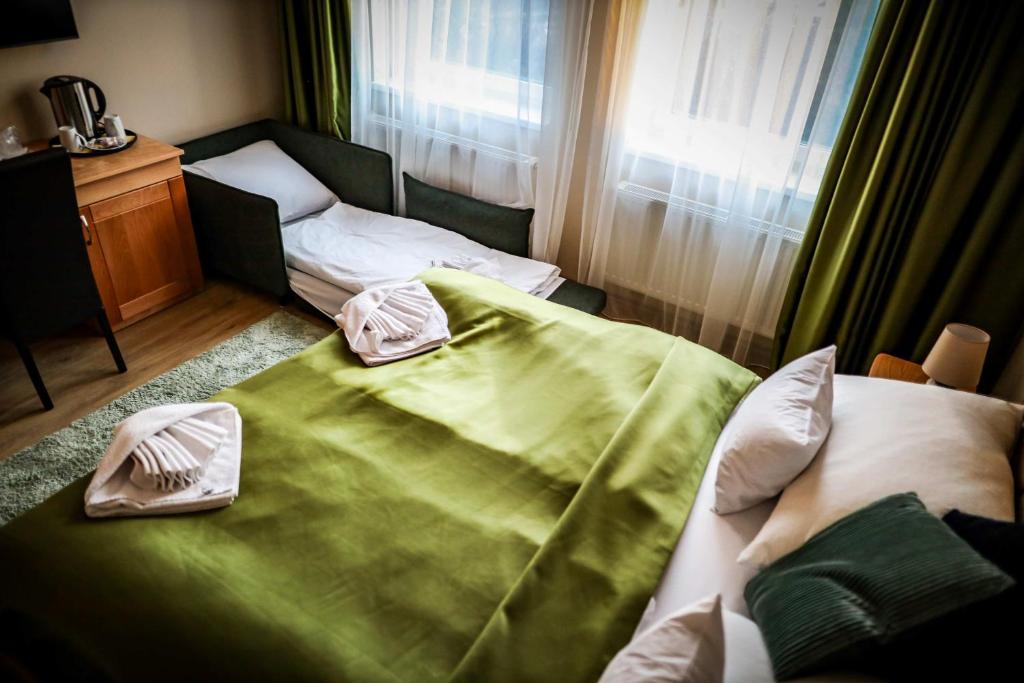 Posteľ alebo postele v izbe v ubytovaní Land-Plan Hotel
