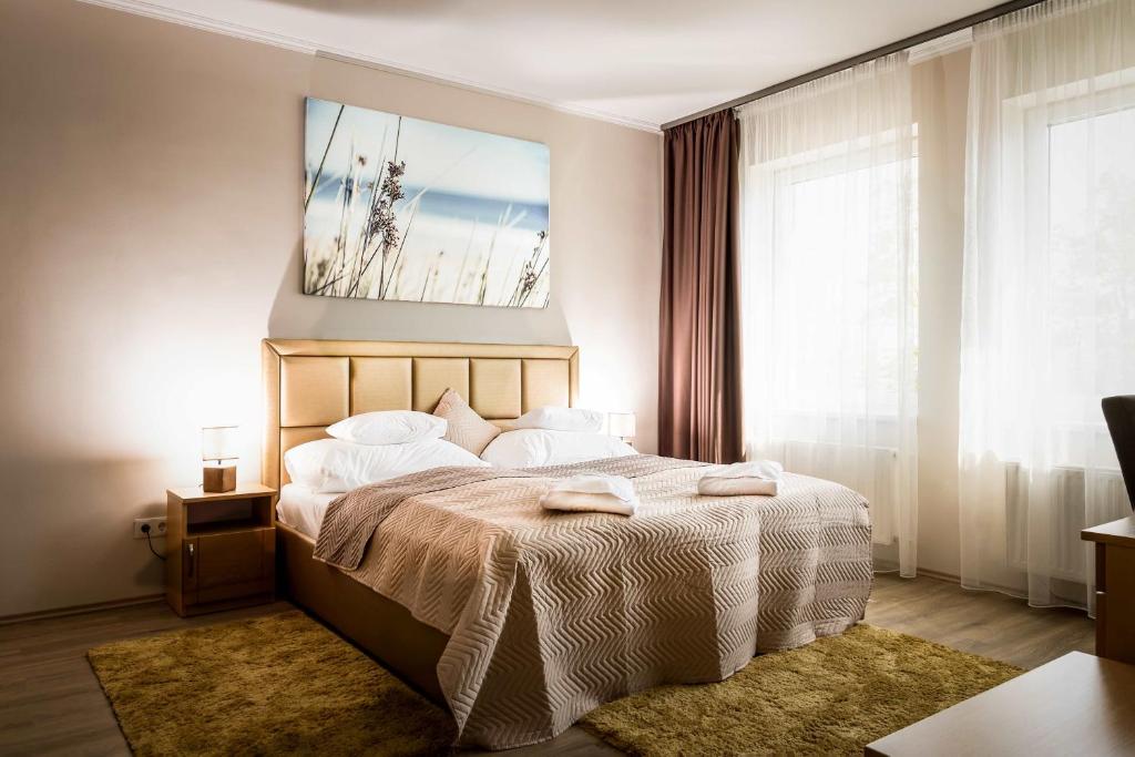 Posteľ alebo postele v izbe v ubytovaní Land-Plan Hotel