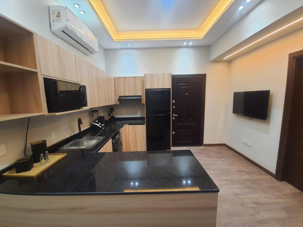 Kuchyň nebo kuchyňský kout v ubytování New Cairo rooms