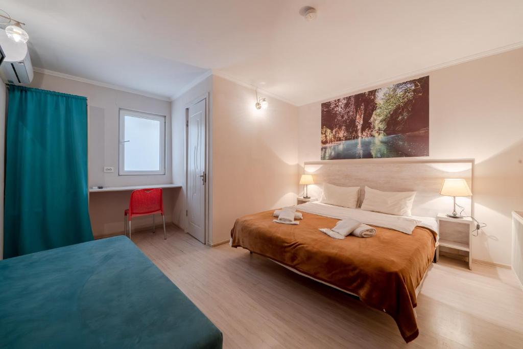 Postel nebo postele na pokoji v ubytování Hotel Tato & CoWorking space