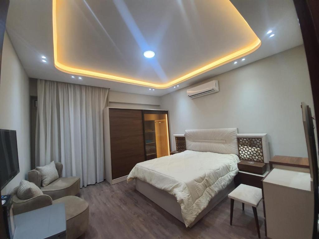 Postel nebo postele na pokoji v ubytování New Cairo rooms